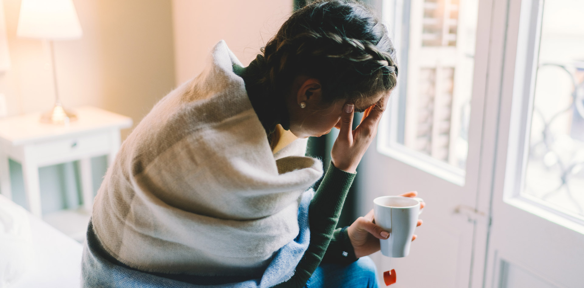 anxious woman drinking tea