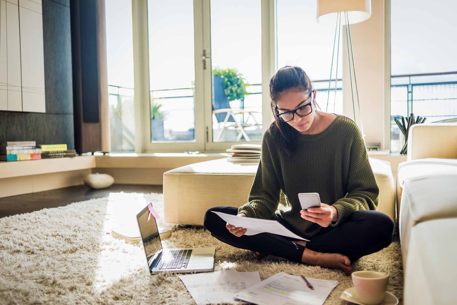 Woman using reading news on mobile device