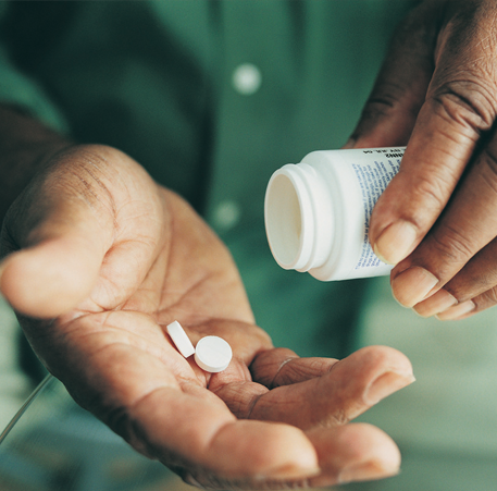 Medication in hand.