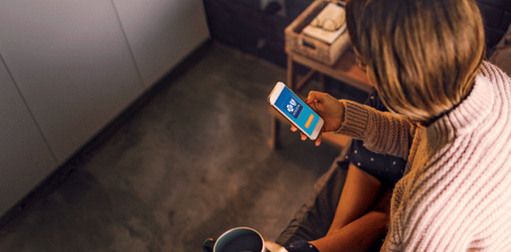A woman using the Horizon Blue app on her smartphone.