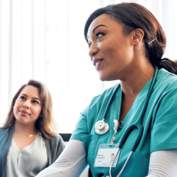 A nurse speaking with a patient.